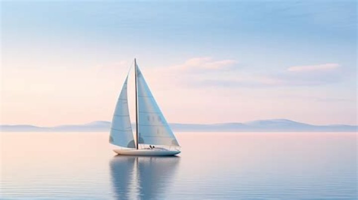 A white sailboat is on the sea A white sailboat is on the sea